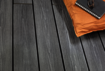 Close-up view of a garden deck with Osmo Multi-Deck co-extrusion profiles in Vintage Grey