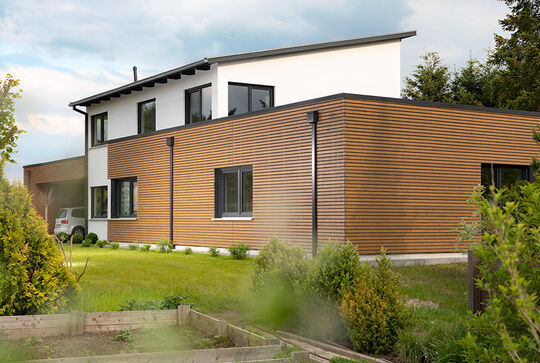 Modern detached house with Osmo thermowood spruce timber cladding