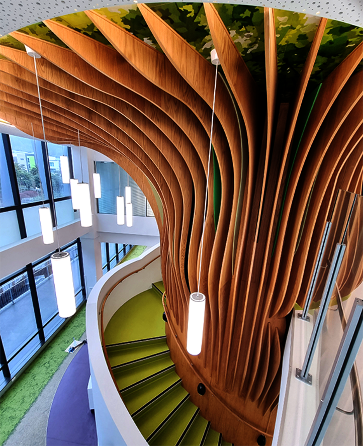 Staircase shaped like an Oak tree treated with Osmo Hartwachs-Öl Original at the entrance of a children’s hospital