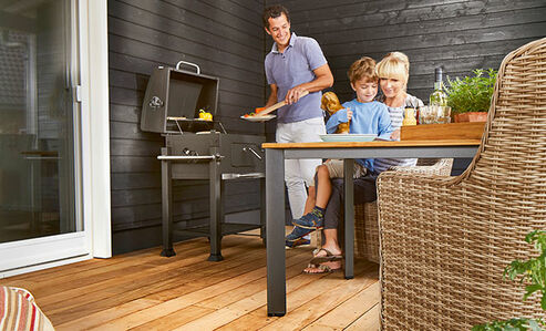 Family barbecue on Osmo garden decking made of Garapa wood