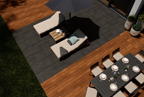 Garden furniture on a garden terrace made of grey Osmo CEWO-Deck ceramic tiles and Garapa decking boards.