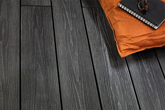 Close-up view of a garden deck with Osmo Multi-Deck co-extrusion profiles in Vintage Grey