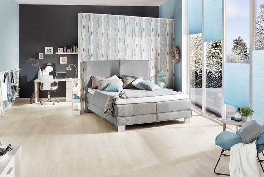 Cosy bedroom with white-stained solid wood Oak flooring from Osmo