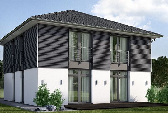 Osmo Fassadenholz Pure in Landhausfarbe Steingrau in Kombination mit weißen Außenwänden und Schwarzem Dach – die farbliche Veredelung von Gebäuden. Osmo News